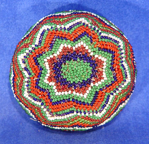 02 - Indian Baskets, Paiute Beaded Basket: Floral Motif on Base, Green Center (1.5" ht x 3.25" d)
c. 1950, Willow and glass seed beads.