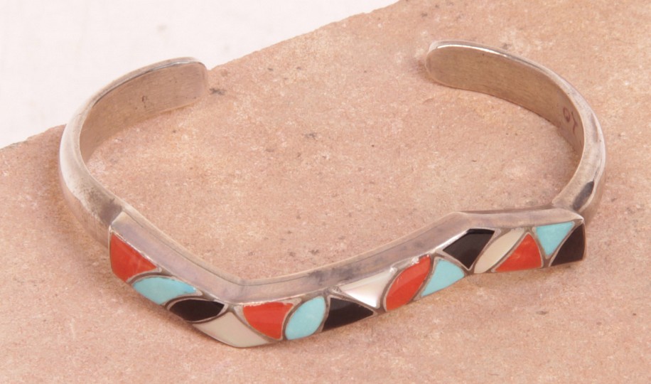 08 - Jewelry-New, Zuni Cuff Bracelet Hallmarked "SMJ": Multistone Inlay, Coral, Turquoise, Jet, Mother of Pearl (5" + 1" gap)
c. 1970, Sterling silver with inlaid stones