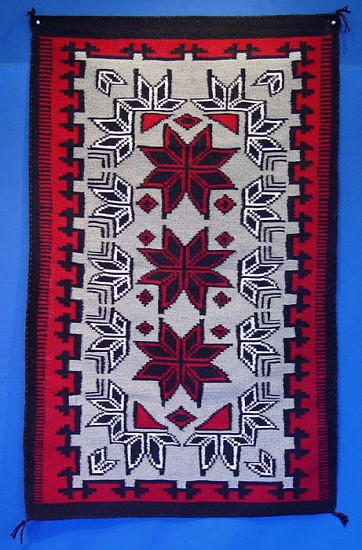 01 - Navajo Textiles, Navajo Rug: c. 1980 Stunning Crystal with Three Eight-Pointed Red Stars, Grey Field, Red Border (36" x 58")
1980, Handspun wool