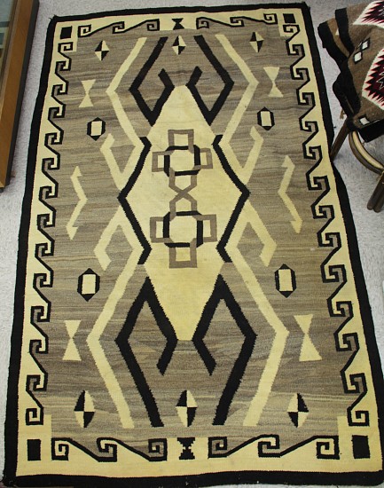 01 - Navajo Textiles, Navajo Crystal Natural Rug: Hooks and Border Motif (53" x 90") Prof. Cleaned, some yellowing remains
c. 1913, Handspun wool
