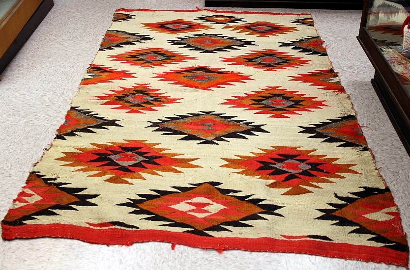 01 - Navajo Textiles, Navajo Rug: c. 1890 Transitional, Diamond Motif, White Field (51" x 82") With overall wear as shown
1890, Handspun wool